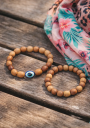 Bracelet avec des perles en bois d'olivier et un œil grec